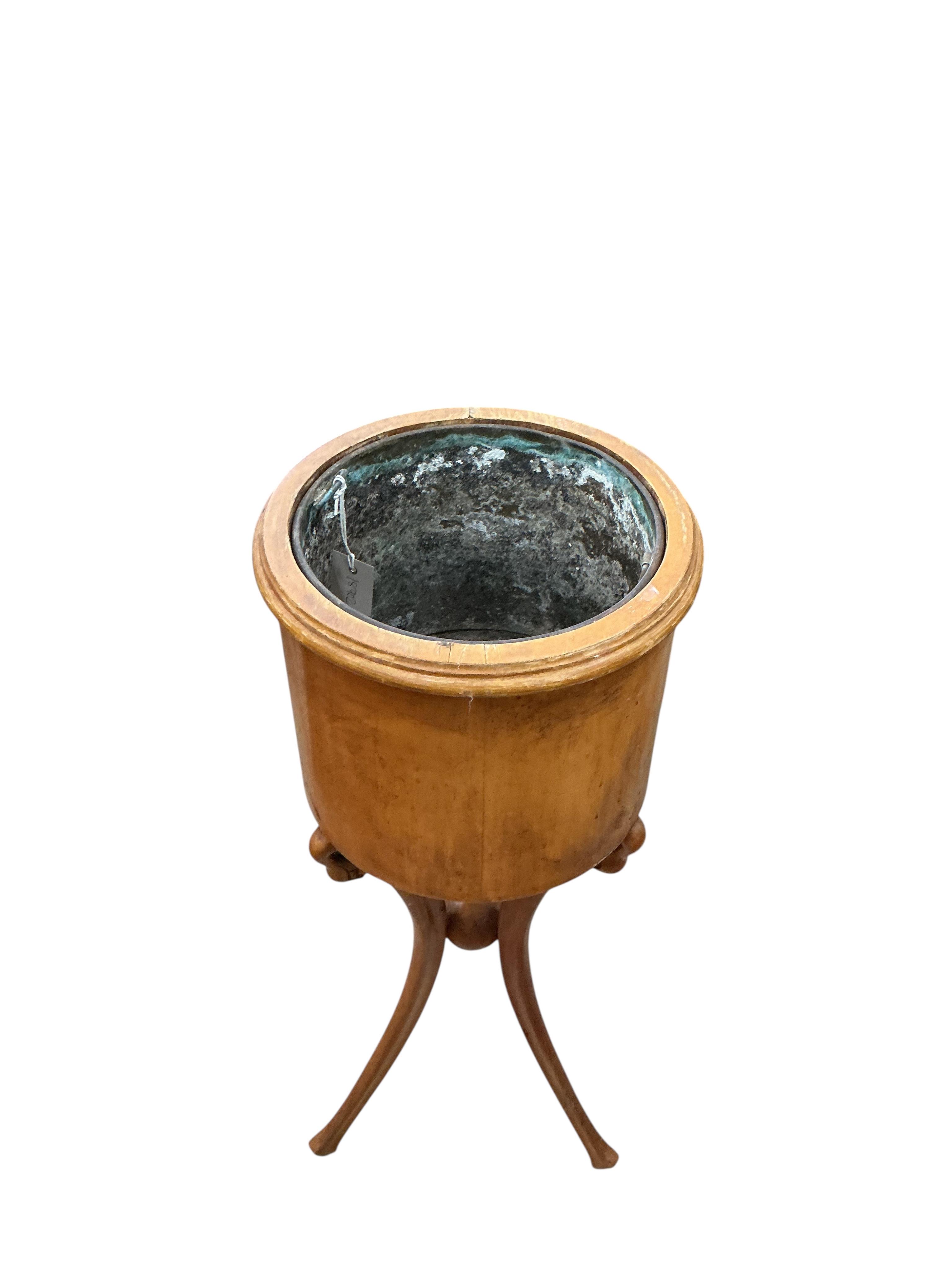 A pair of Empire style circular mahogany jardinieres with swan neck tripod bases, height 83cm